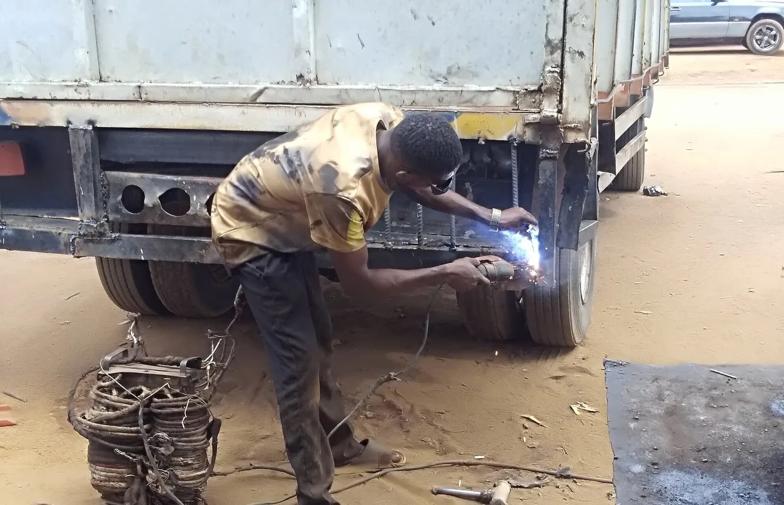 Sample photo, general repairs work in Nigeria: Nigerian welder at work