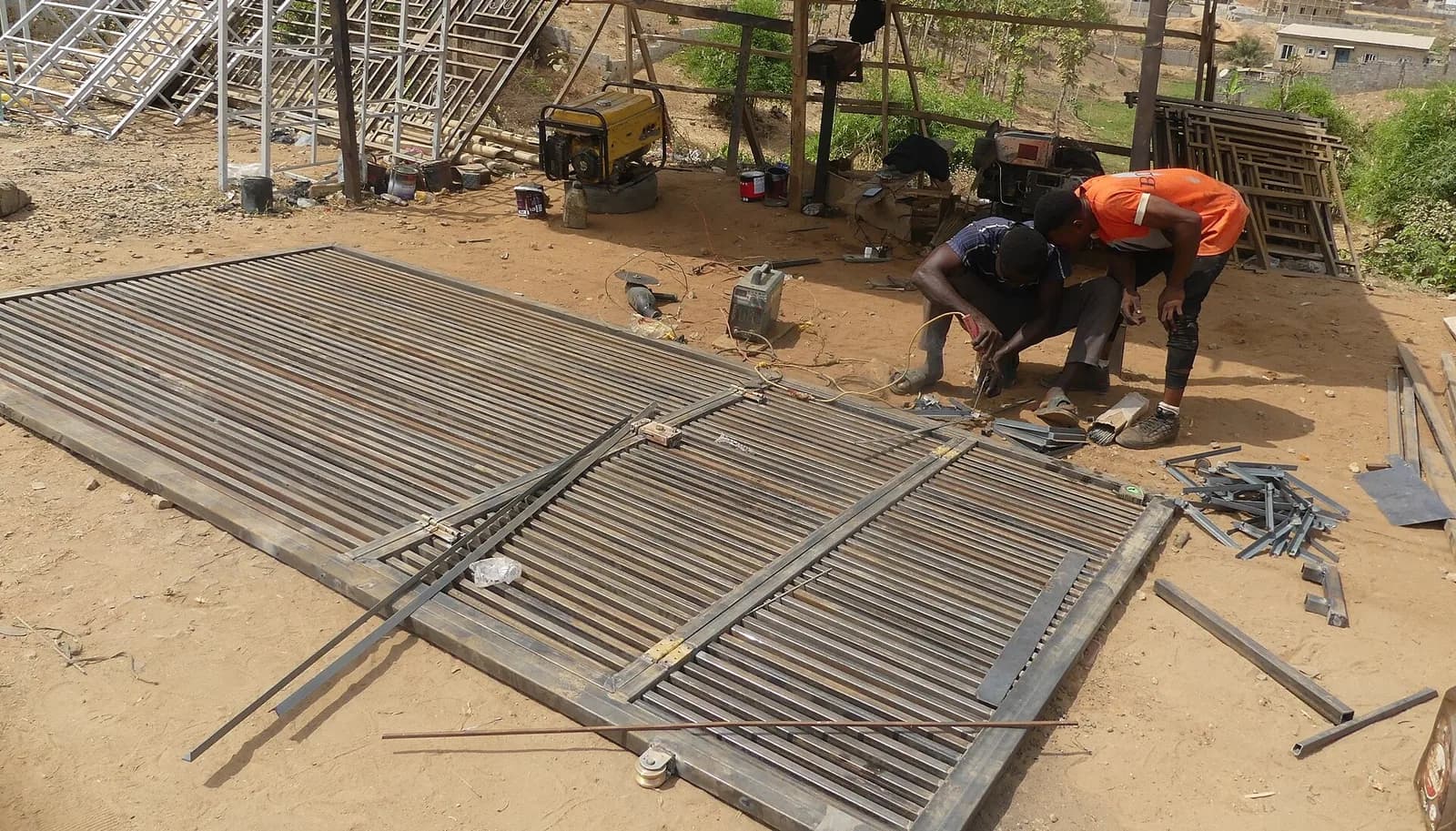 Sample photo, iron burglary work in Nigeria: A welder making a building gate 02