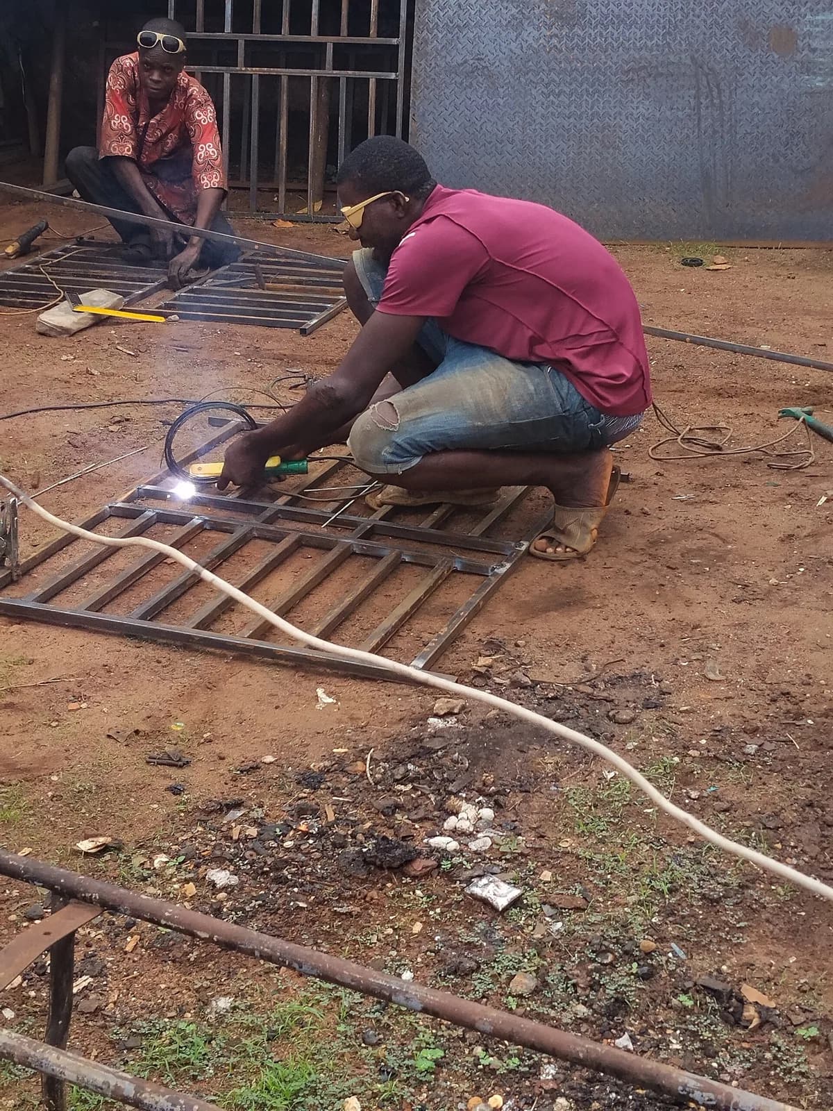 Sample photo, iron burglary work in Nigeria: Man Welding a Metal Gate