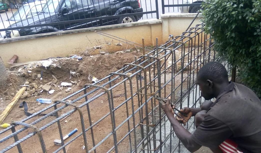 Sample photo, pillars / columns work in Nigeria: Ironbender fixing a retaining wall reinforcement